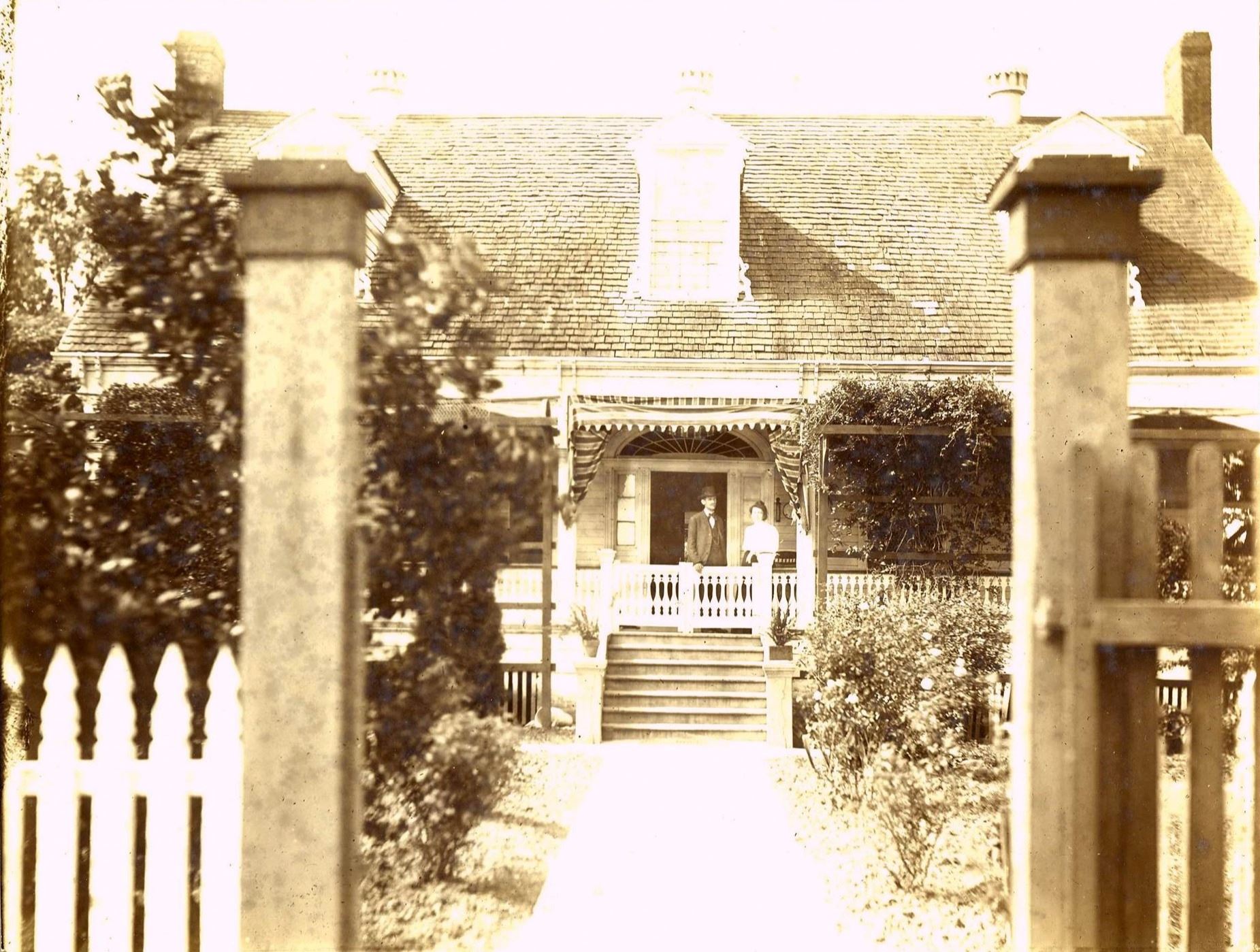 The Hill family outside their new home